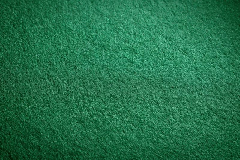 Close-up of green felt fabric surface filling the frame
