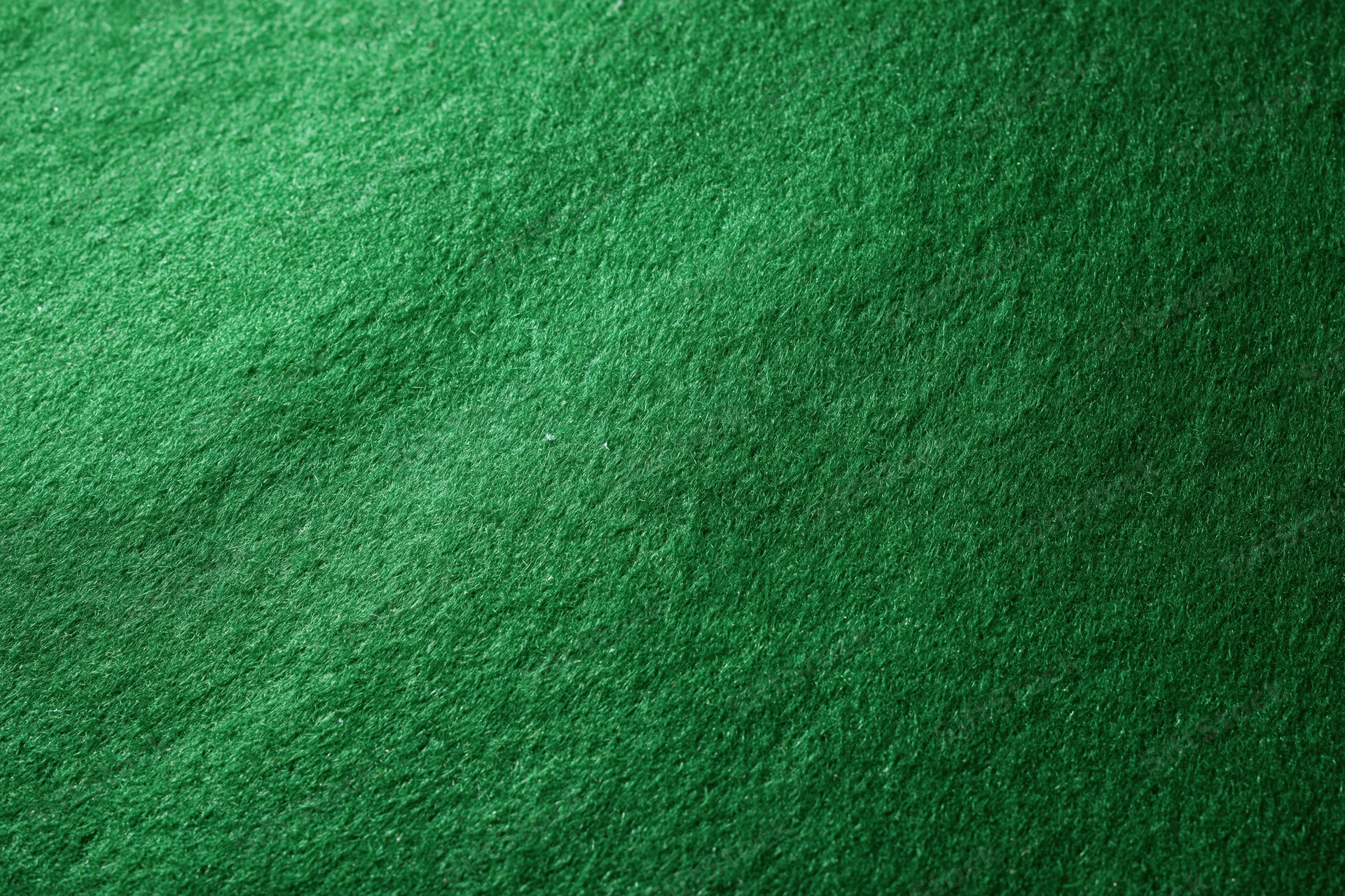Close-up of green felt fabric surface filling the frame