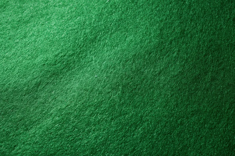 Close-up of green felt fabric surface filling the frame
