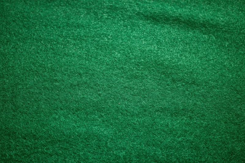 Close-up of green felt fabric surface filling the frame