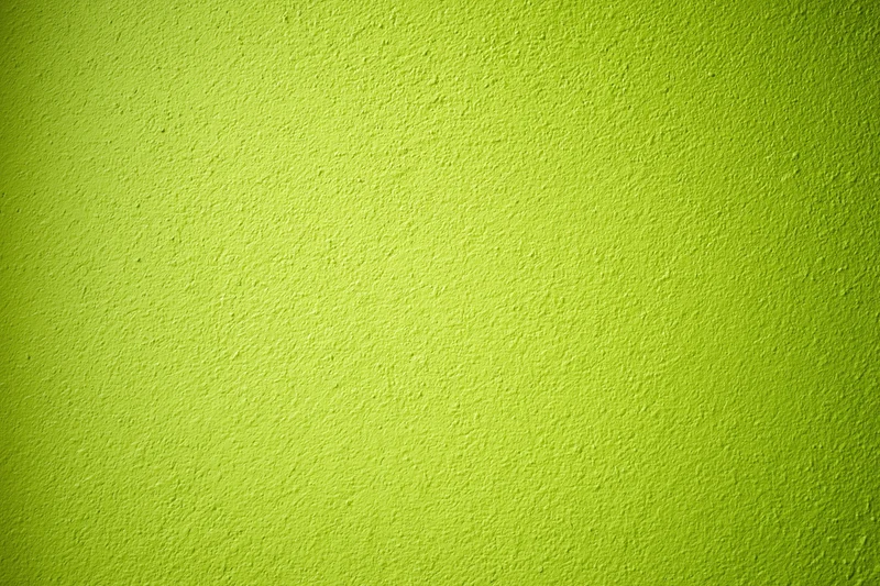Close-up of lime green painted concrete wall texture