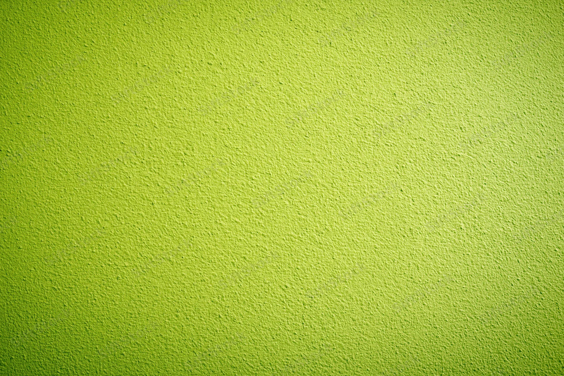 Close-up of lime green painted concrete wall surface