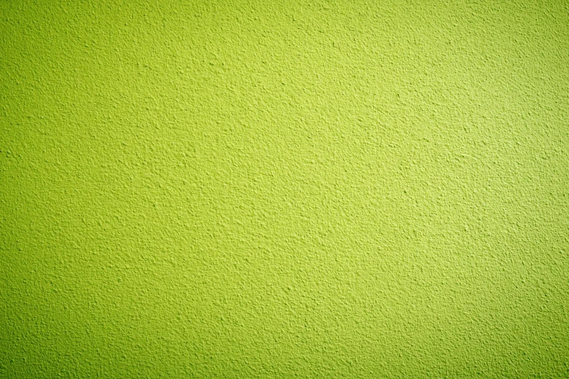 Close-up of lime green painted concrete wall surface