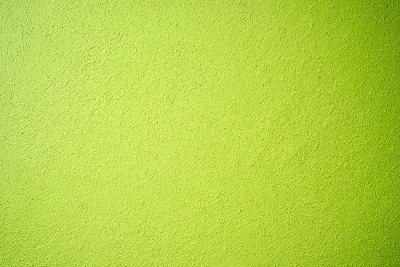 Close-up of lime green painted concrete wall surface