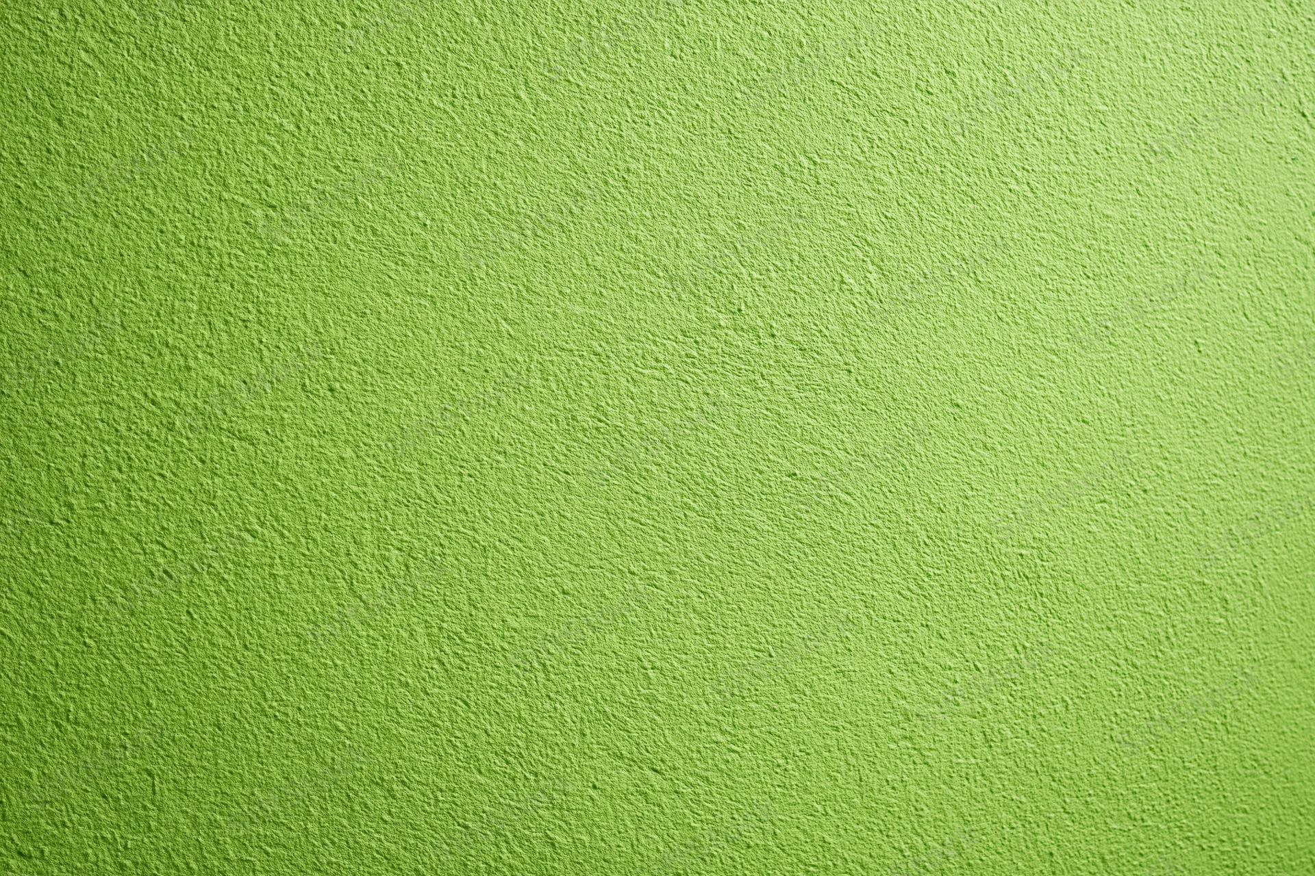 Close-up of lime green painted concrete wall surface