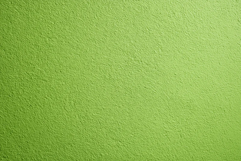 Close-up flat shot of a lime green painted concrete or plaster