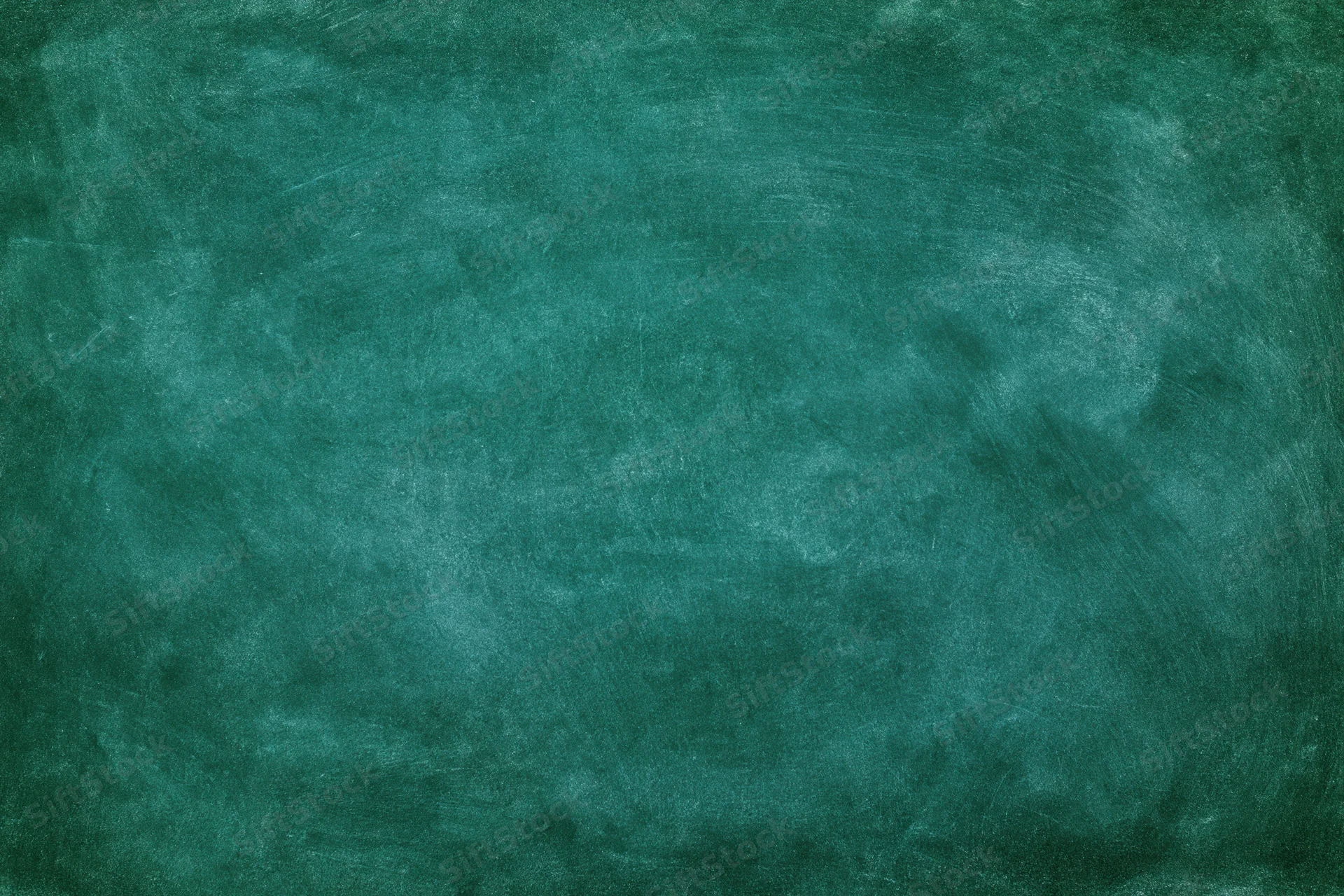 Close-up of a worn green chalkboard surface with smudged marks and residue