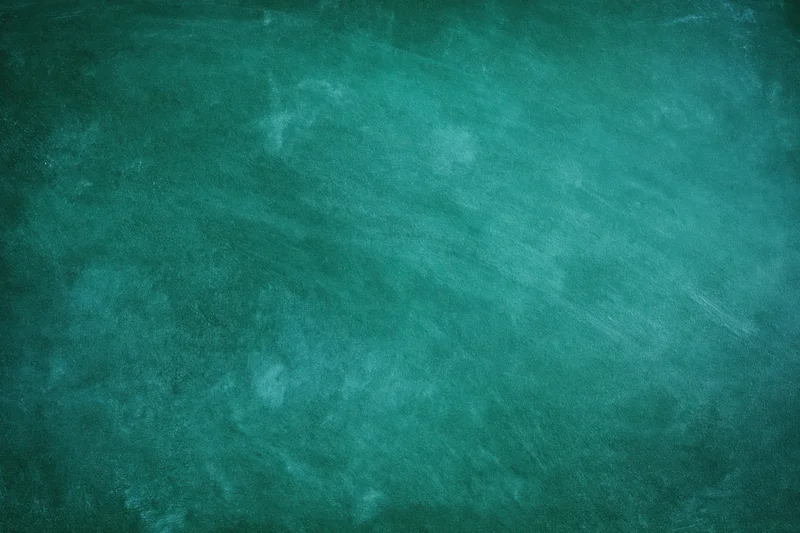 Worn green chalkboard surface with visible texture and smudges from use