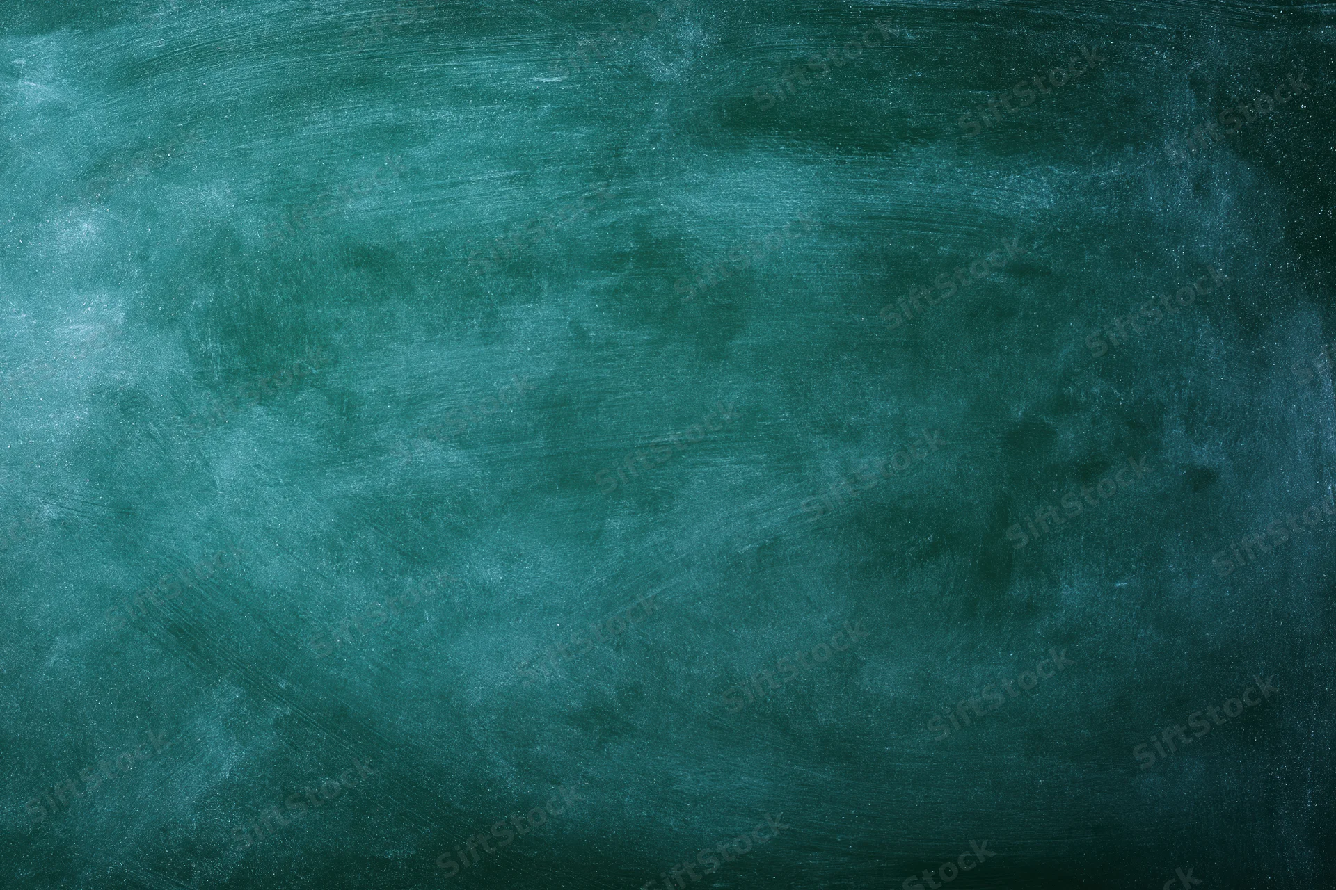 Worn green chalkboard surface with smudged texture and residue from chalk use
