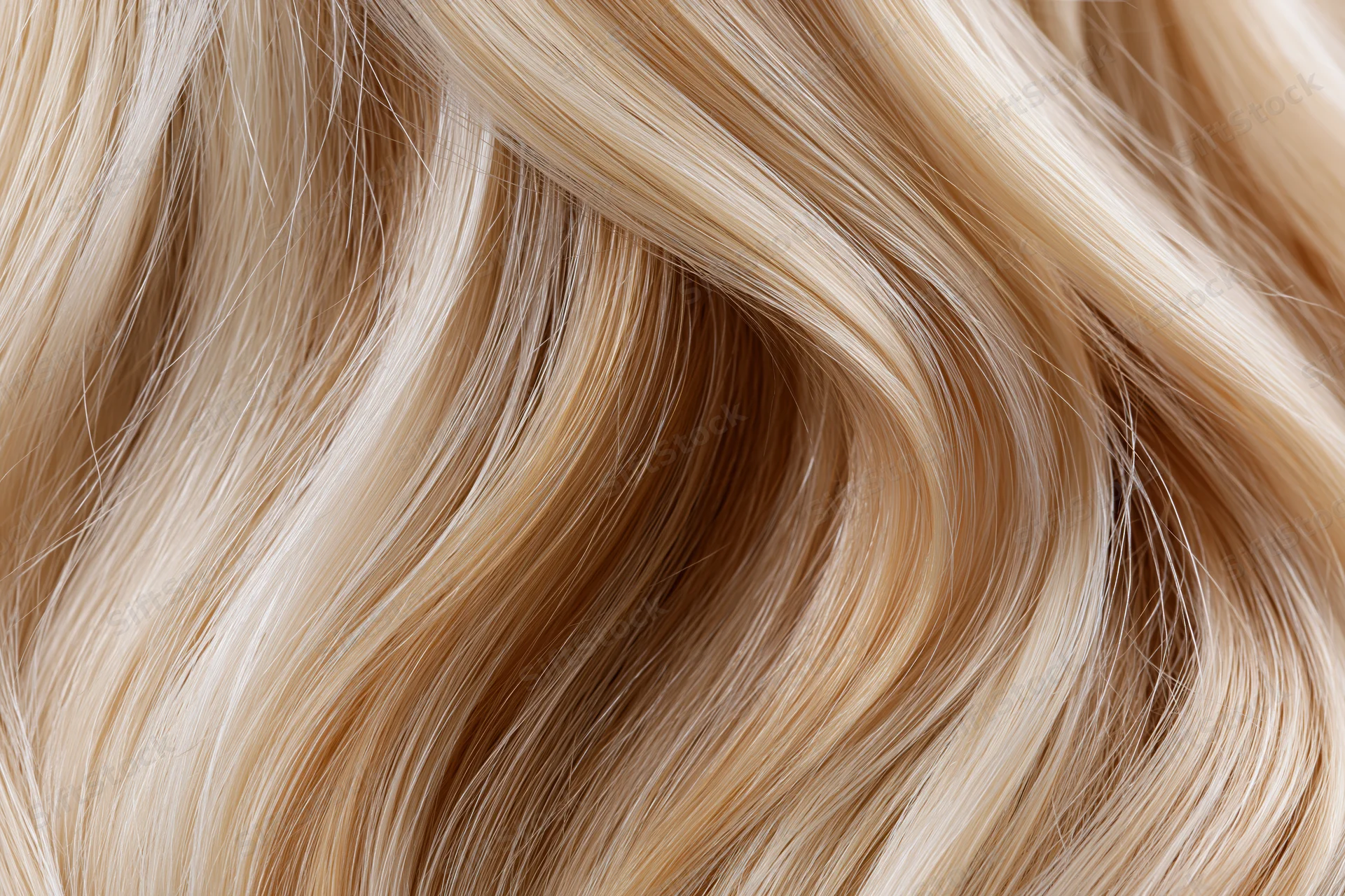 Flowing blonde hair strands in close-up macro view