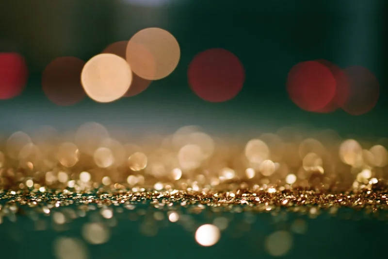 Close-up macro shot of gold glitter particles on a surface