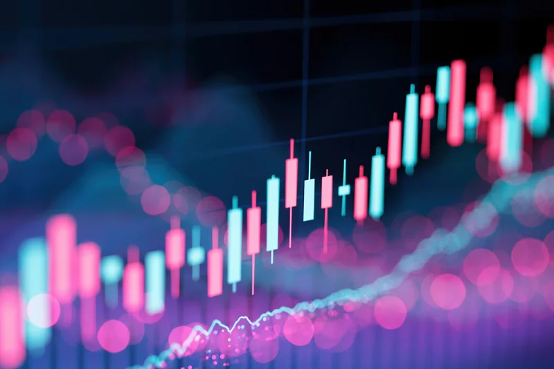 Glowing digital candlestick chart showing upward market trend on a screen