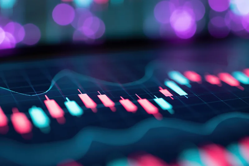 Digital candlestick chart glowing on a screen with blurred neon lights in the background