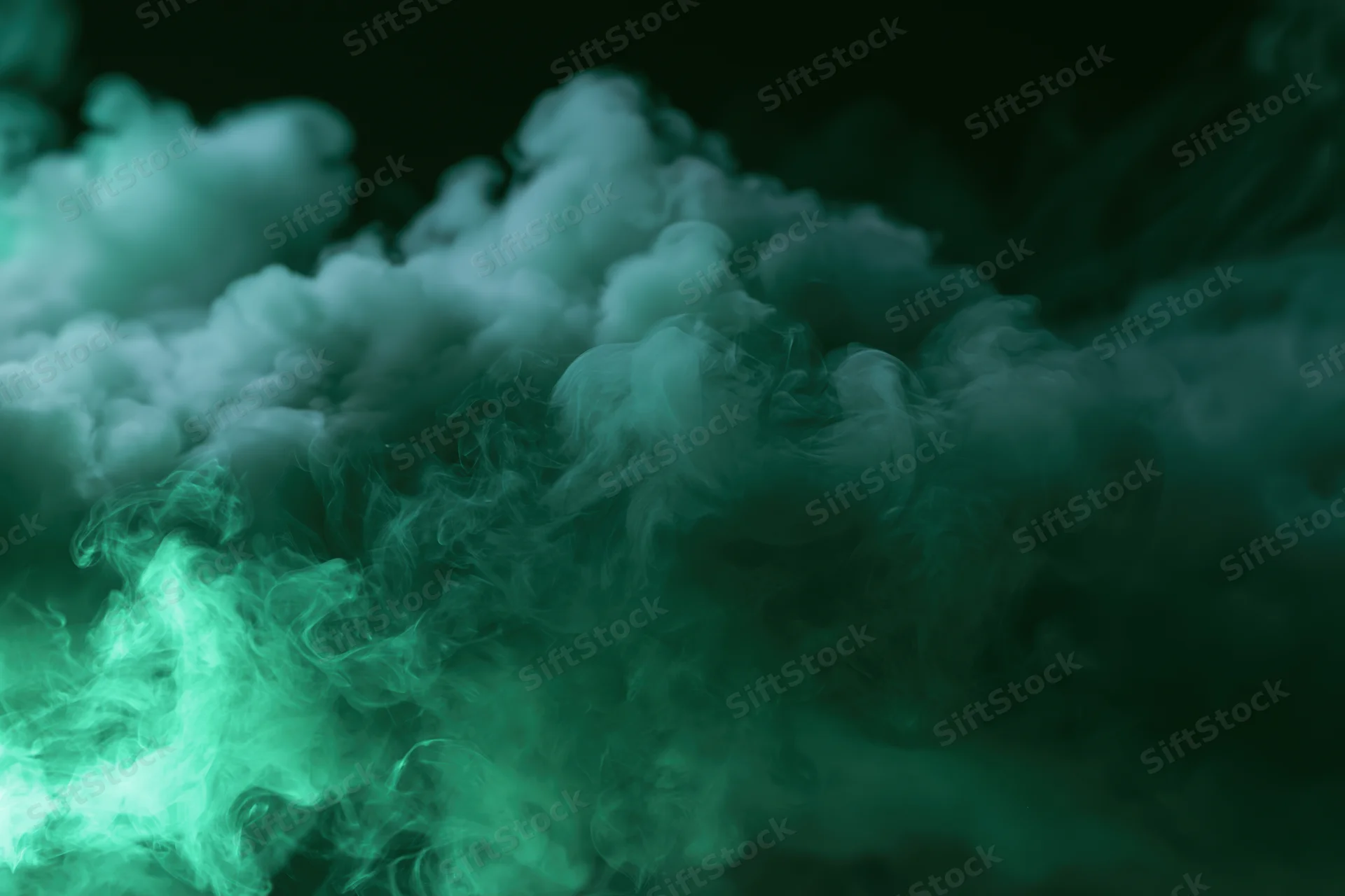 Swirling green smoke clouds filling the frame against a dark background