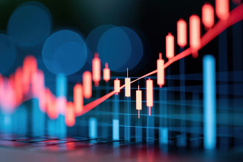 Glowing candlestick chart showing upward trend on digital display