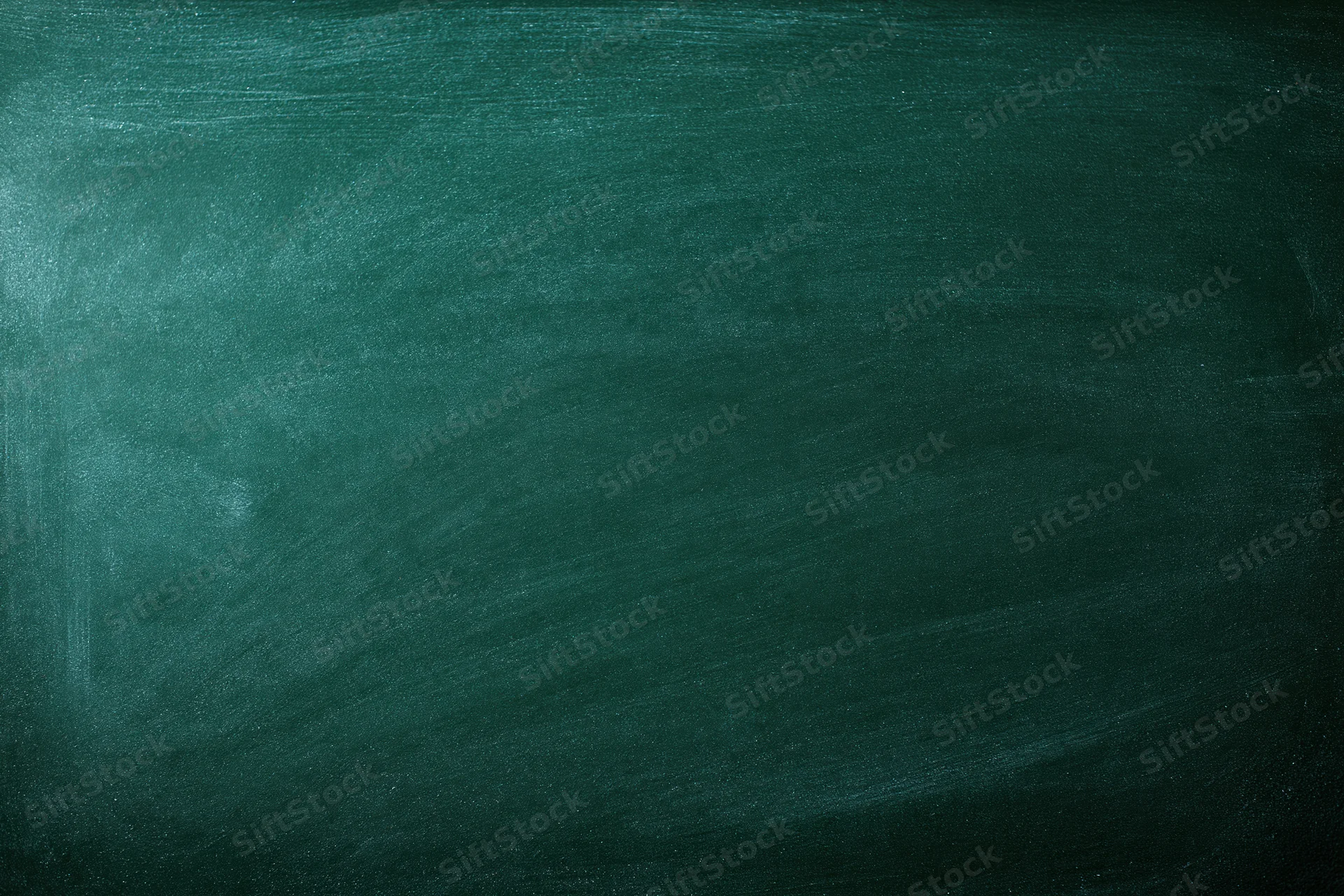 Dark green chalkboard surface filling the frame with faint smudges and texture