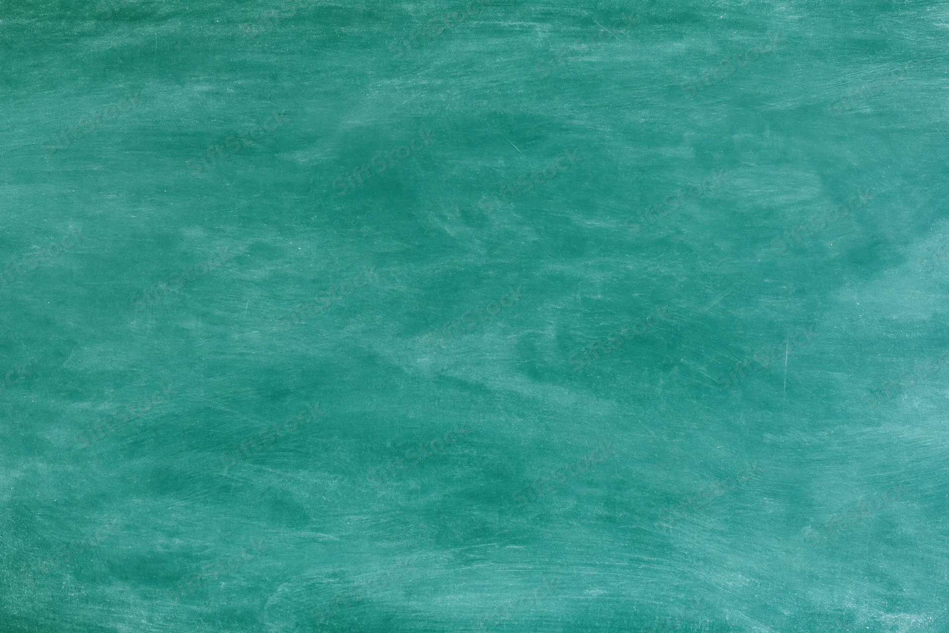 Empty green chalkboard surface filling the frame