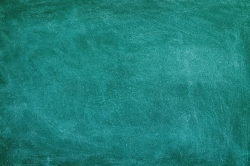 Empty green chalkboard surface with erased marks and texture filling the frame
