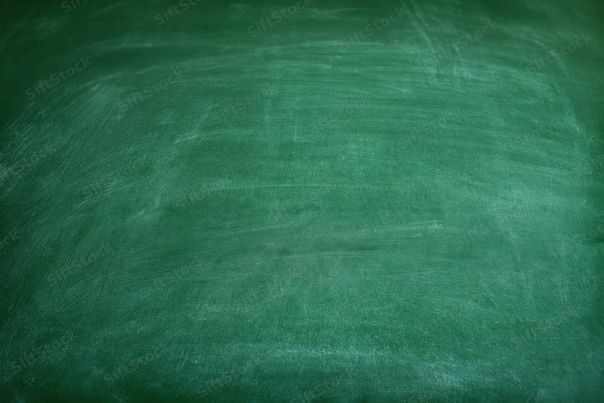 Empty green chalkboard surface filling the frame