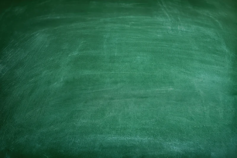 Empty green chalkboard surface filling the frame