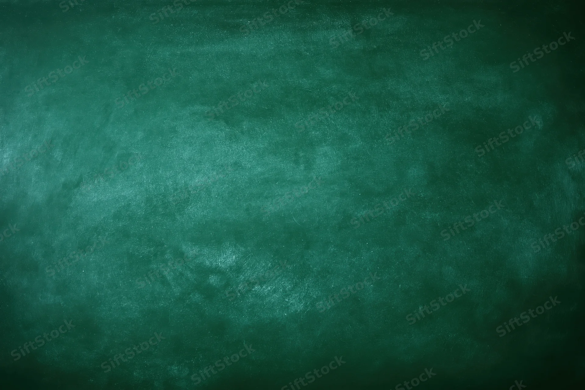 Empty green chalkboard surface filling the frame