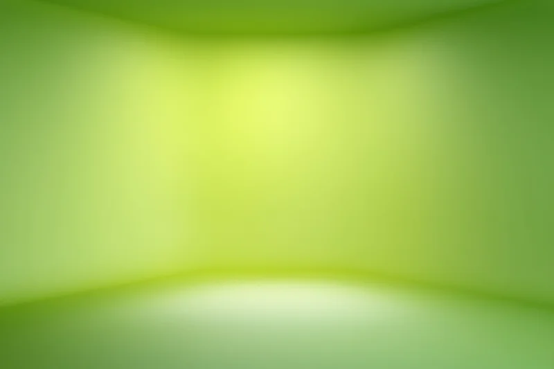 Smooth green gradient backdrop in an empty studio space