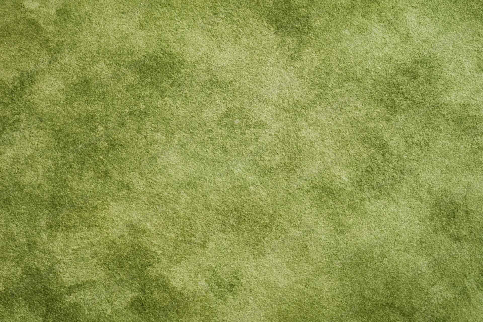 Close-up of a mottled green painted canvas surface