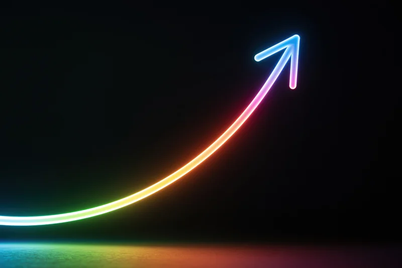 Glowing neon arrow curving upward on dark background with rainbow gradient light trail