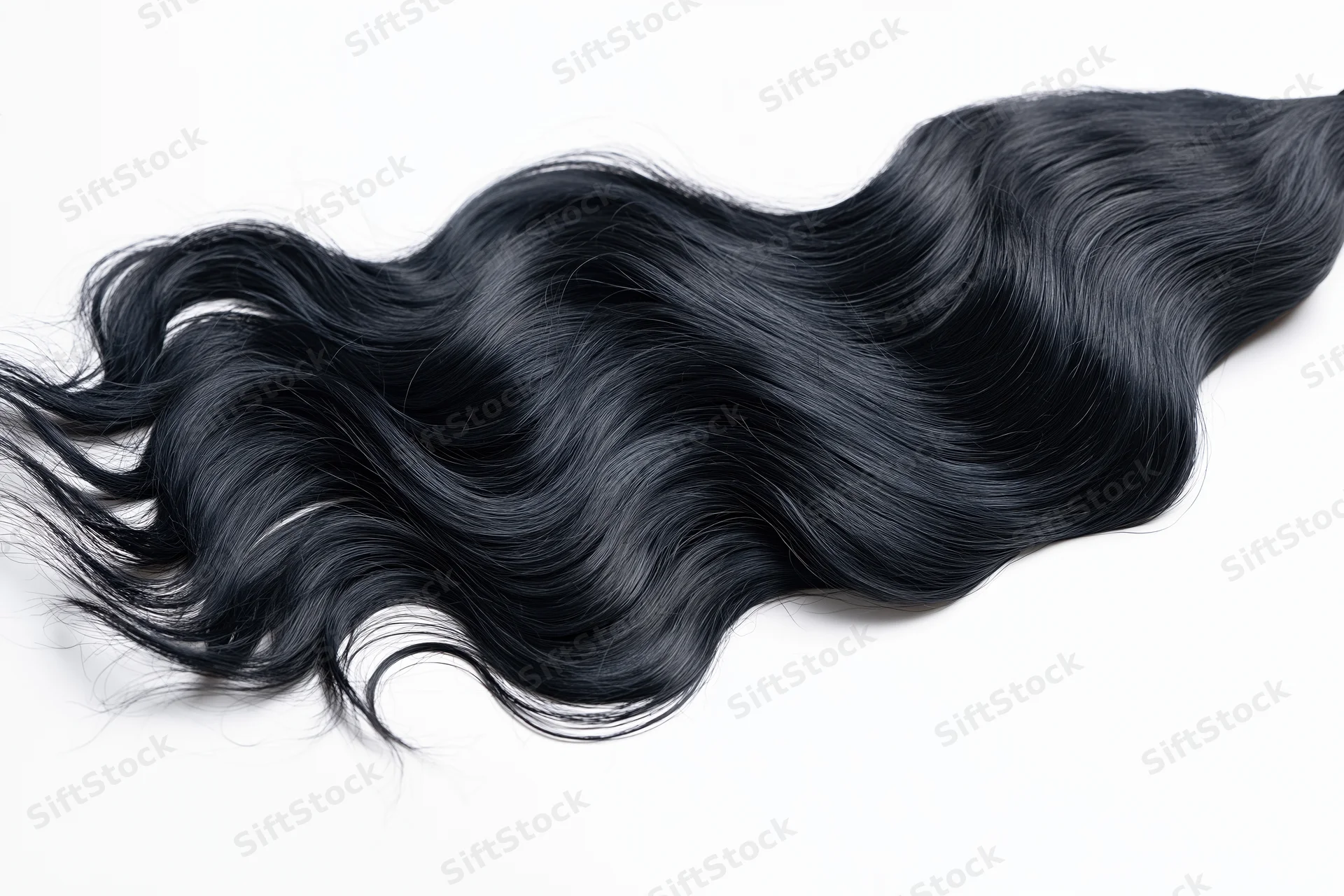 Long black wavy hair extension floating against white background