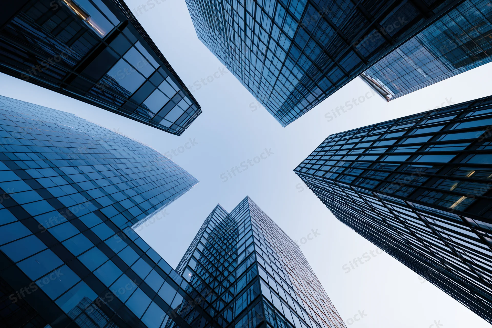 Low angle view of glass skyscrapers rising into the sky in a modern city center