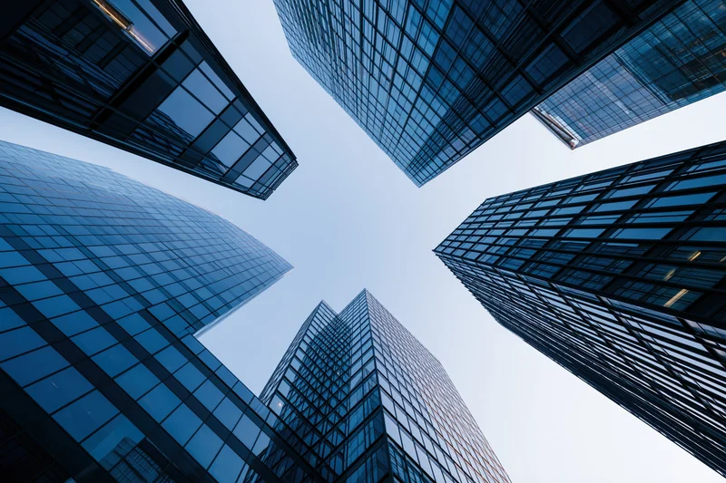 Low angle view of glass skyscrapers rising into the sky in a modern city center