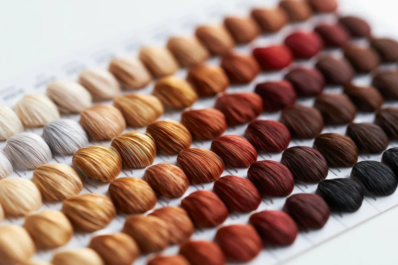 Rows of hair color swatches arranged on a chart for salon use