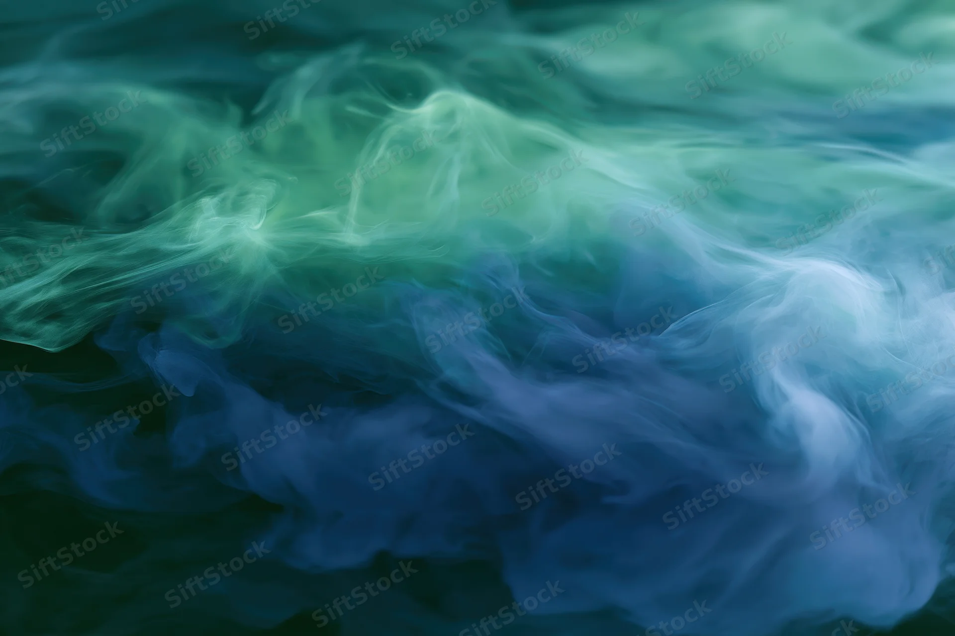 Swirling ink clouds dispersing in water full frame macro abstract