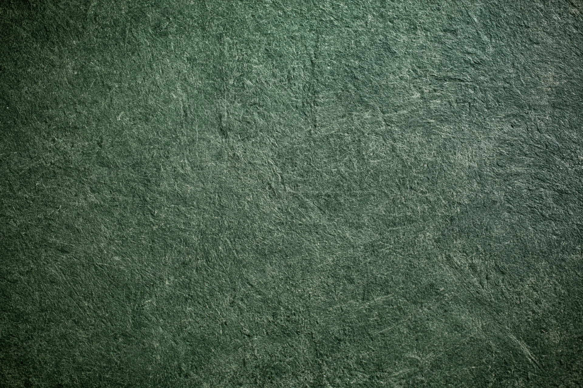 Weathered concrete wall surface filling the frame