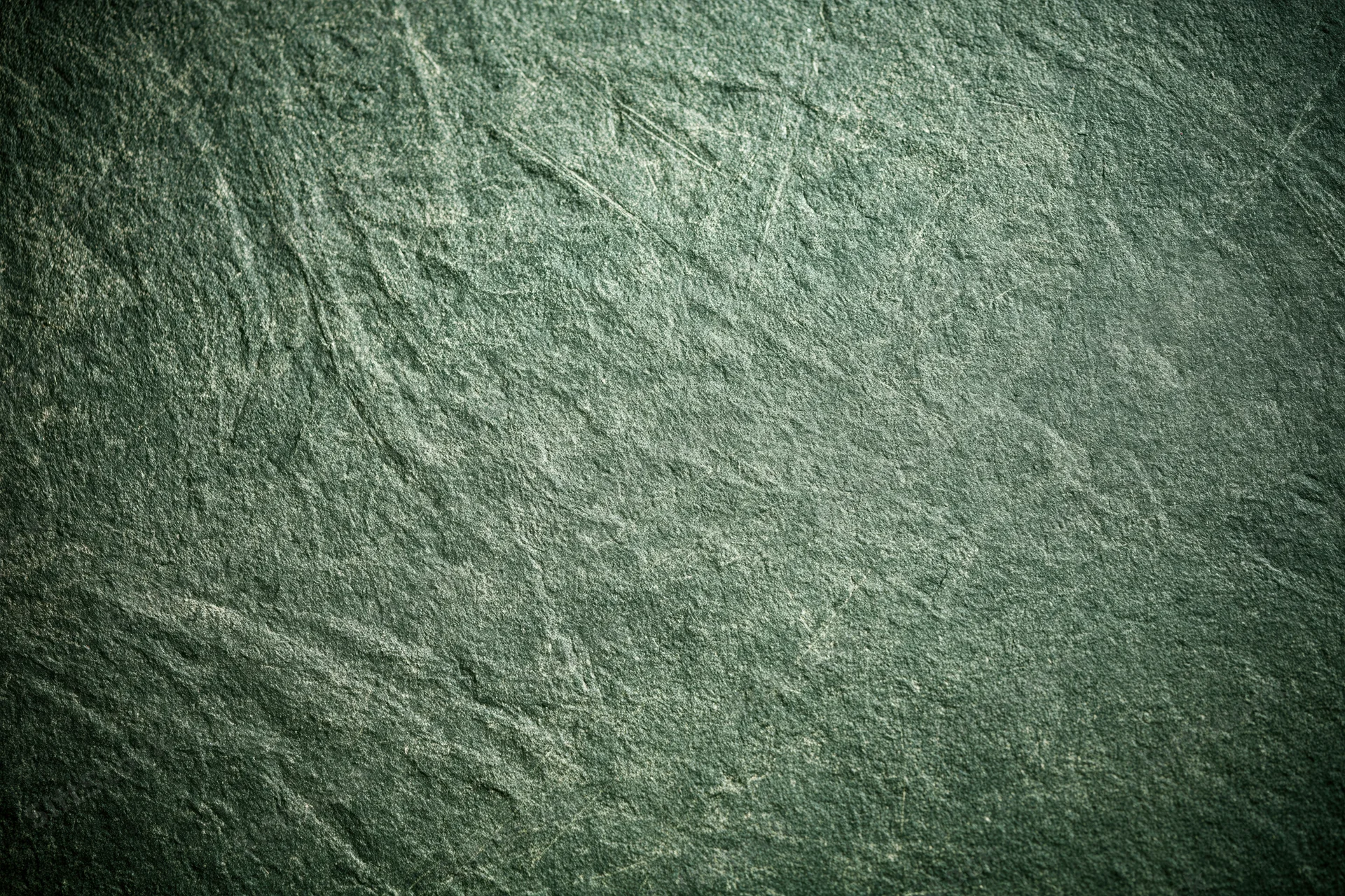 Weathered concrete wall surface filling the frame