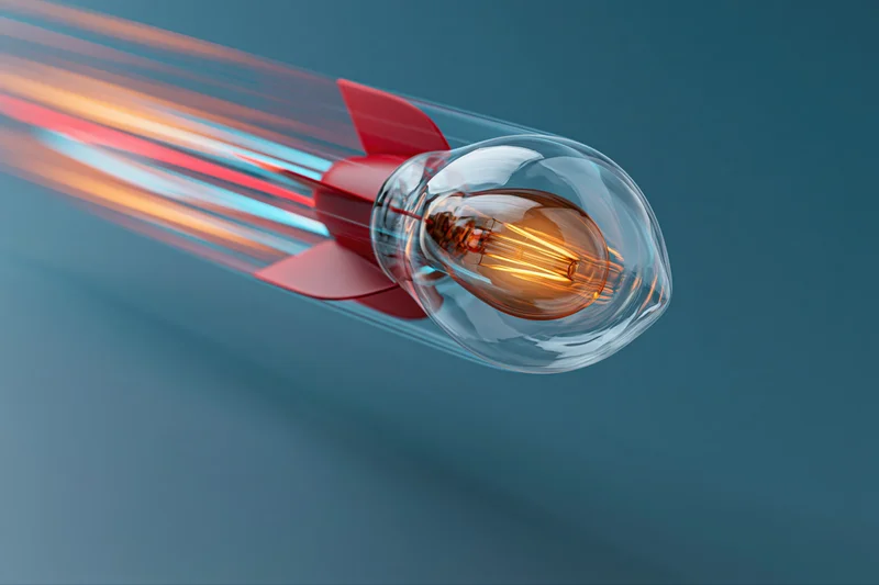 Lightbulb with red rocket fins launching through blue background