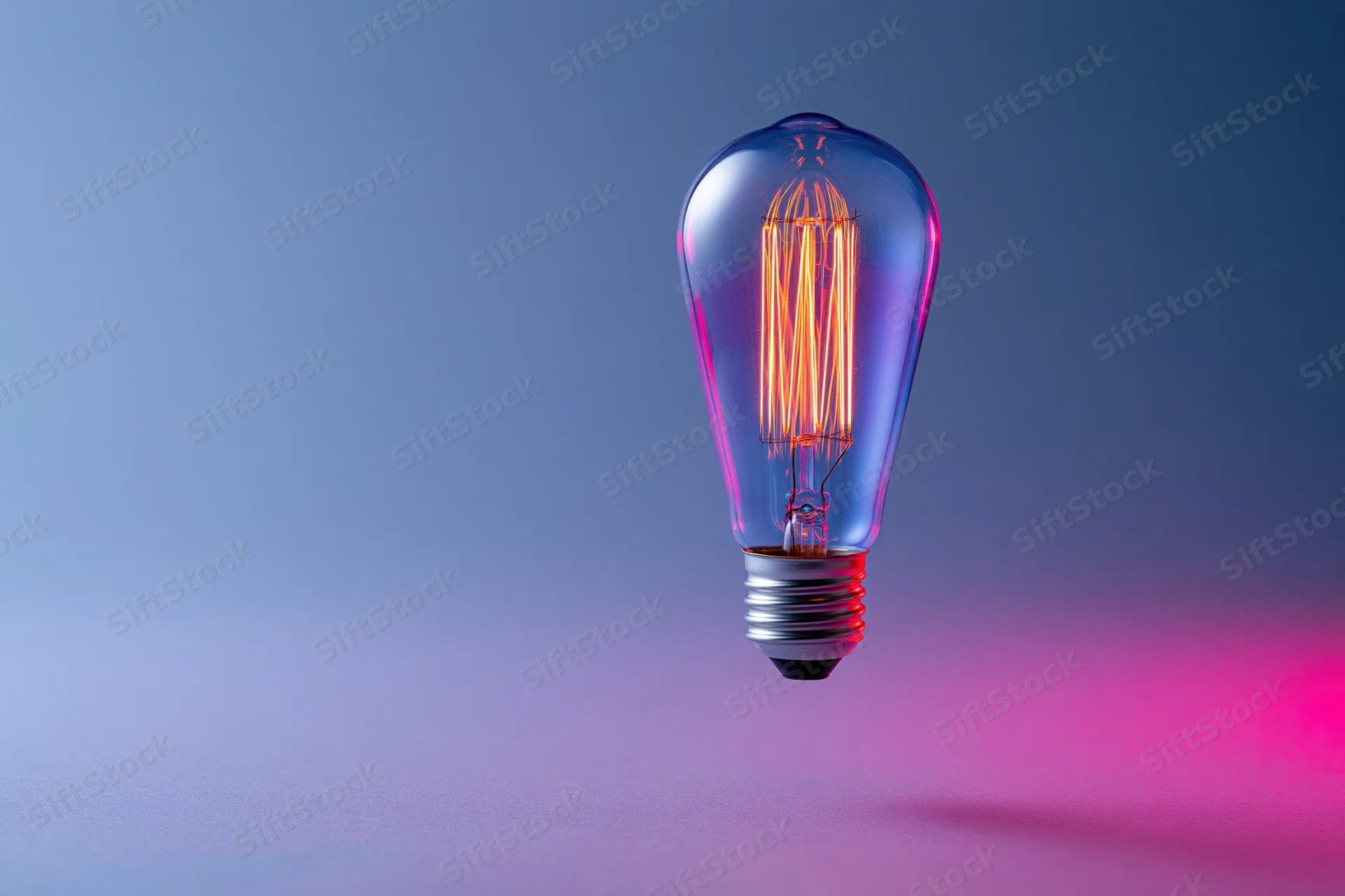 Glowing edison filament lightbulb floating against a smooth gradient background with pink and blue lighting