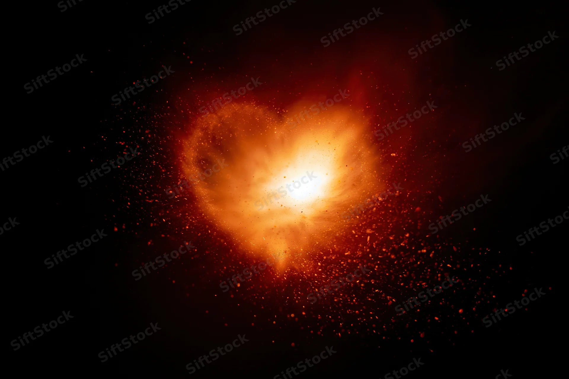 Glowing heart-shaped light explosion with sparks against dark background
