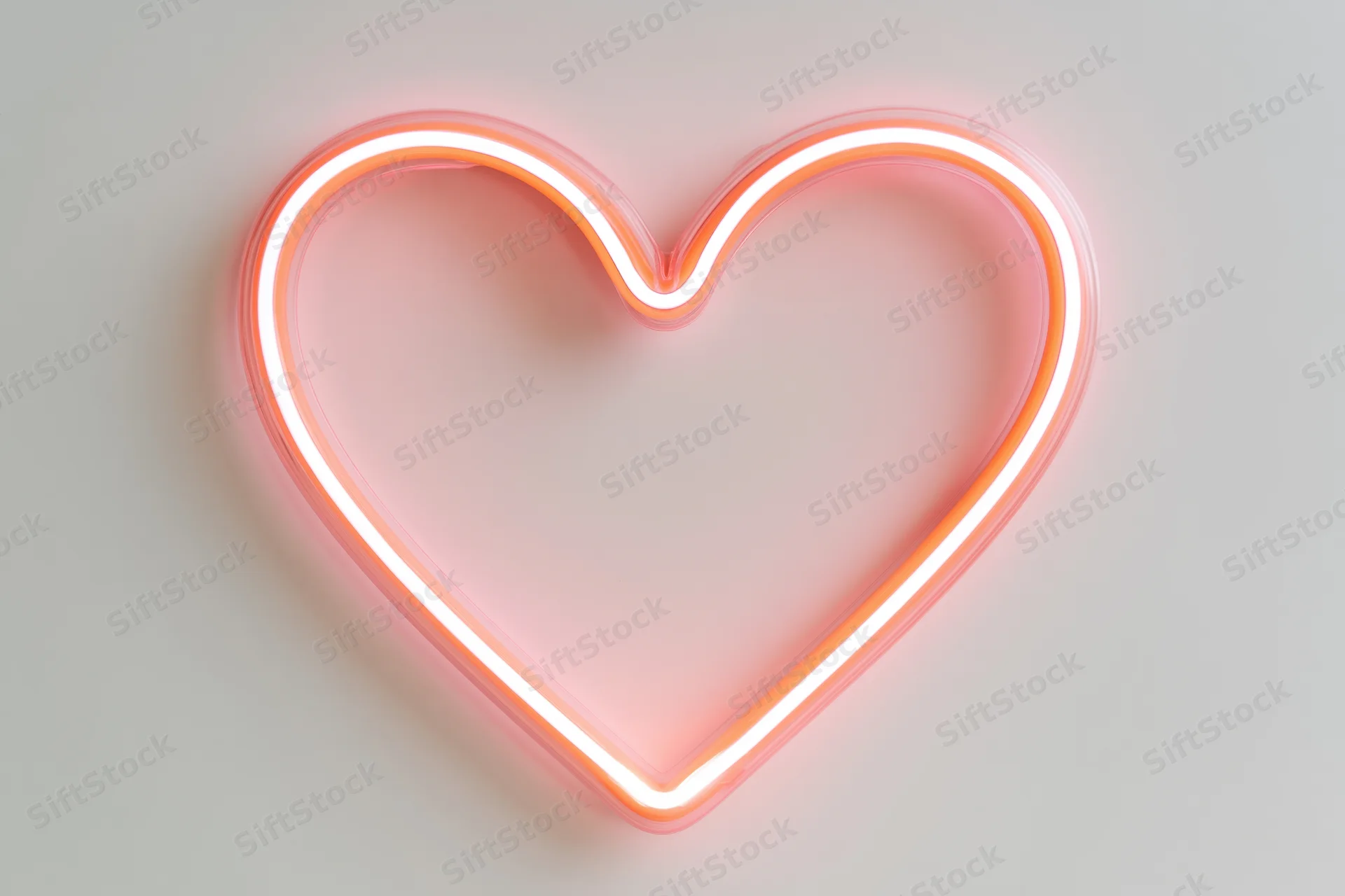 Glowing neon heart outline on a plain white wall