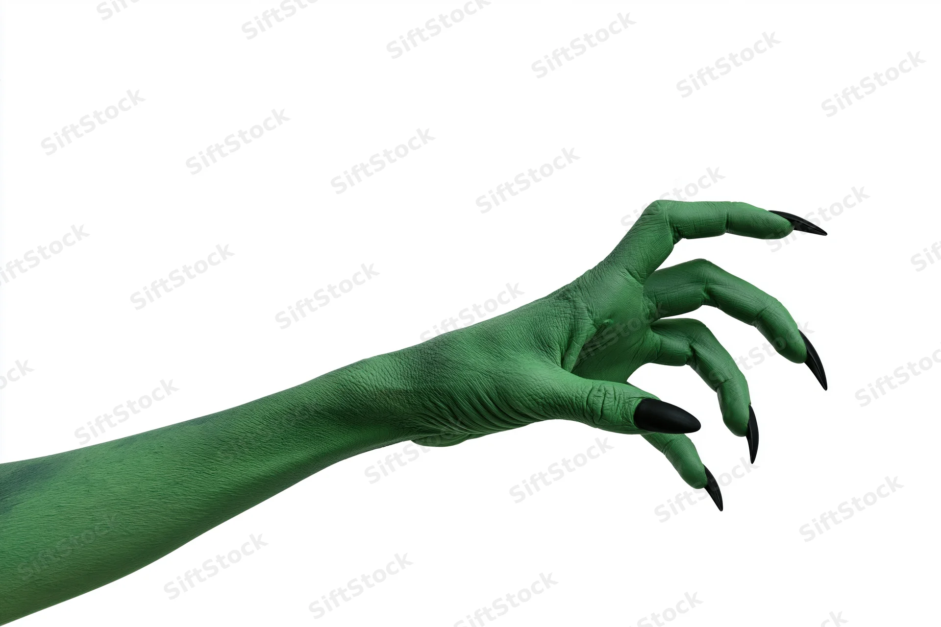 Green-painted hand with black claws extended against white background