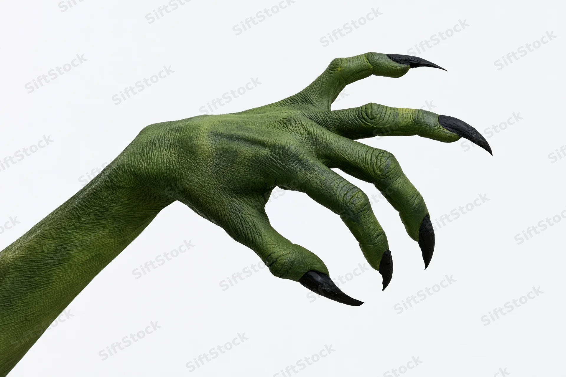 Green monster hand with sharp black claws extended against white background