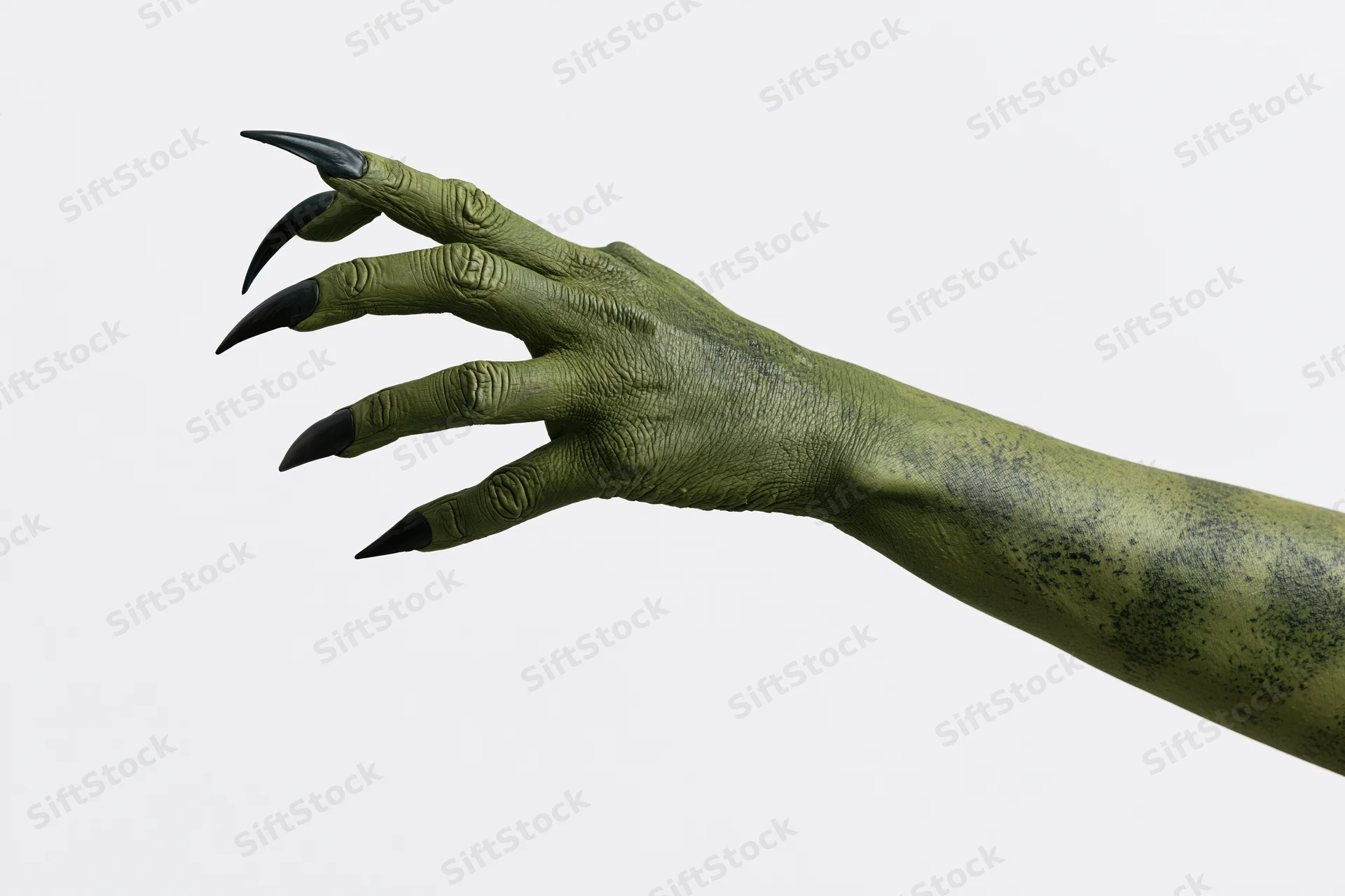 Green monster hand with sharp claws extended against white background