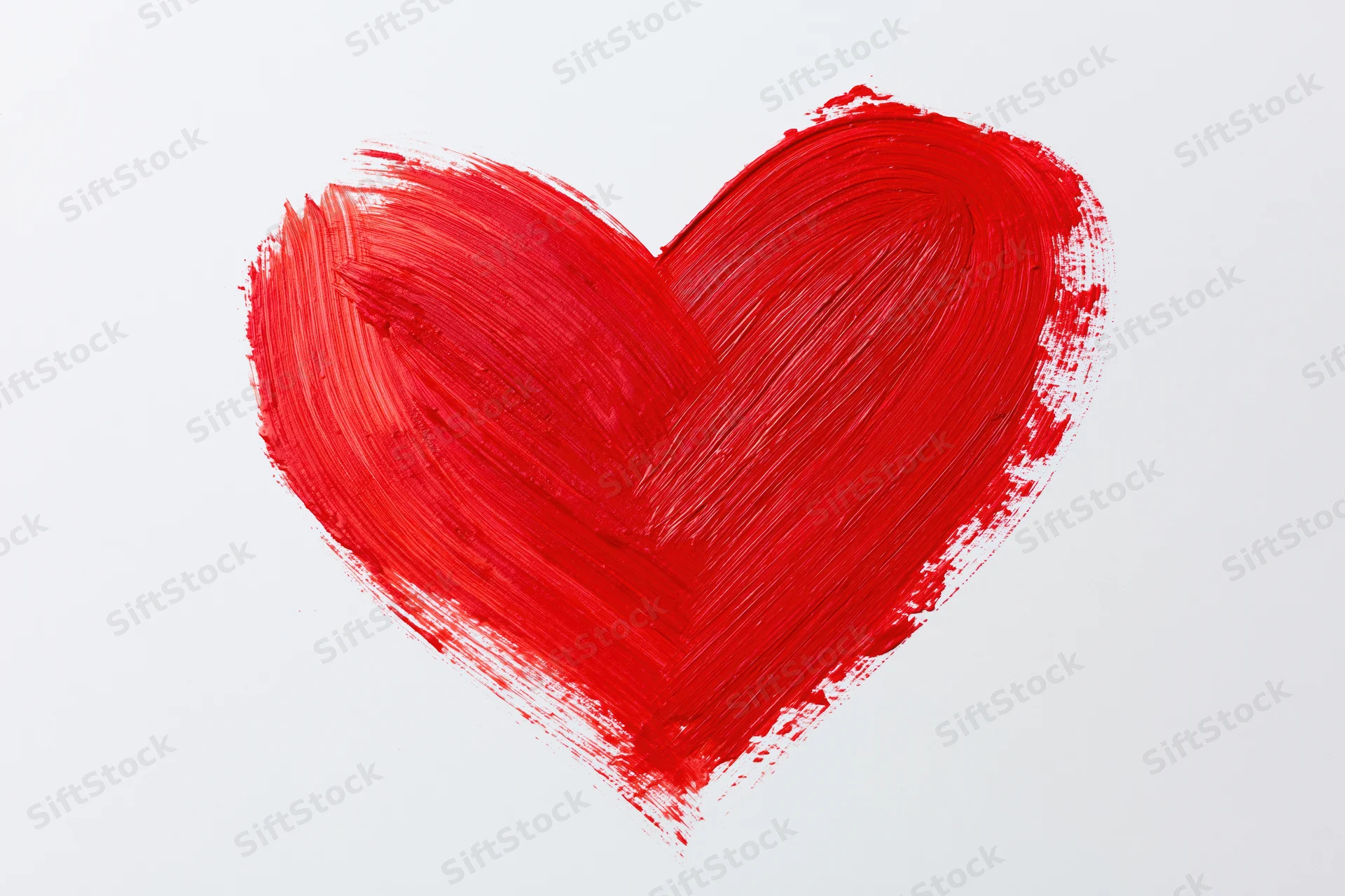 Hand-painted red heart on plain white background