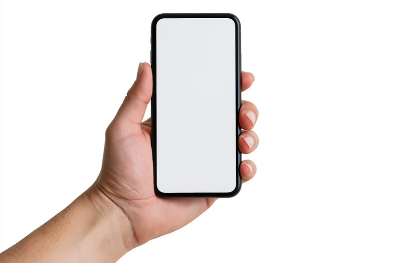 Hand holding smartphone with blank screen against white background