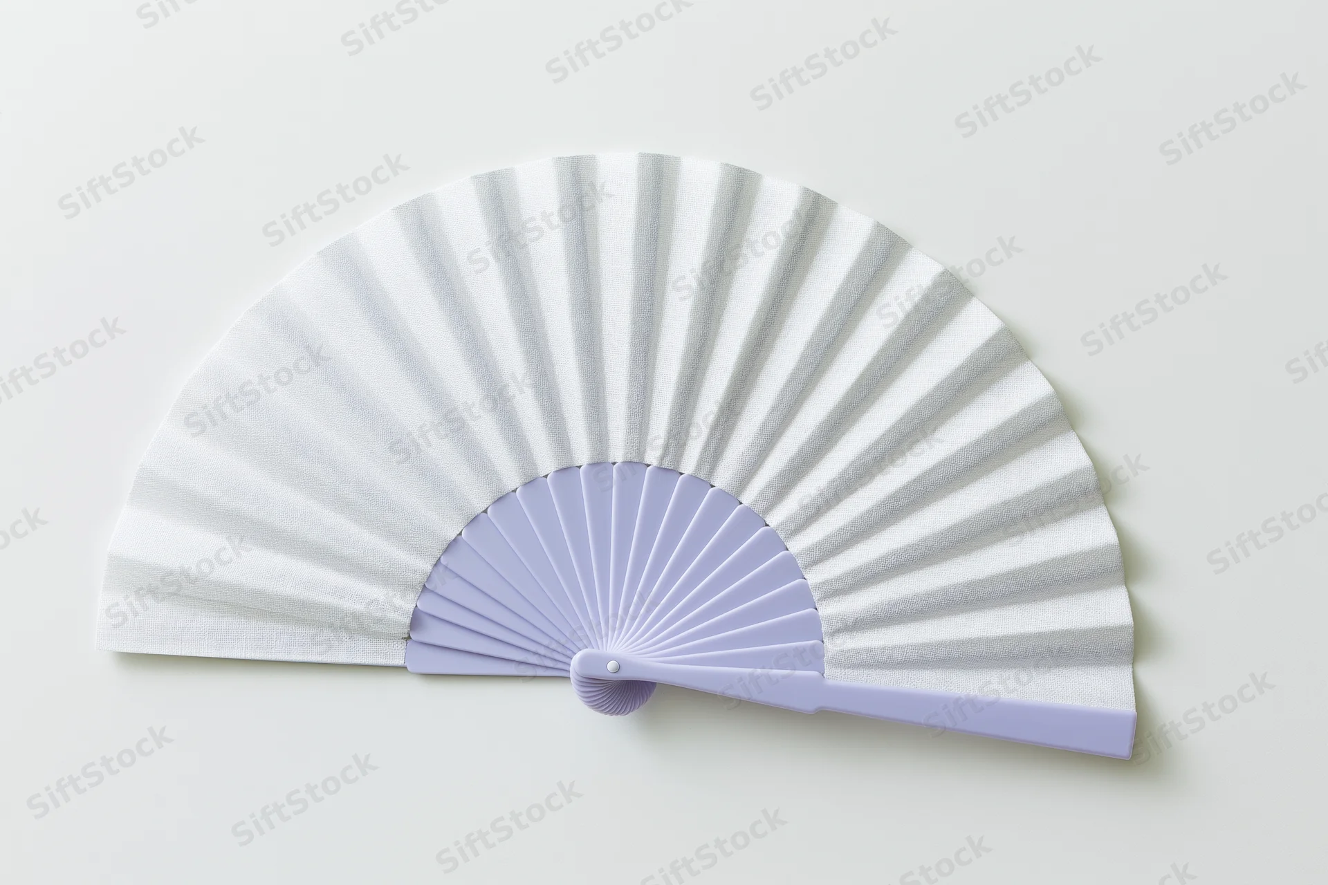 Open folding hand fan with white paper and lavender plastic frame lying flat on white surface
