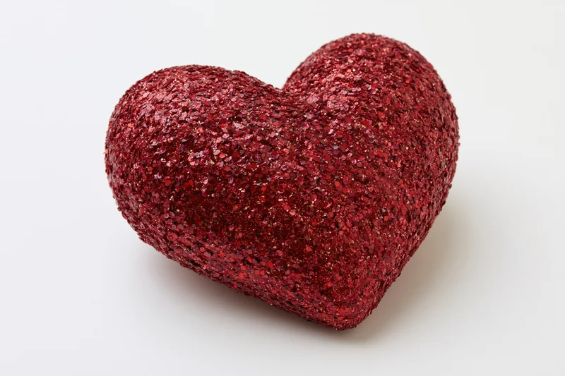 Puffy heart-shaped decoration covered in glitter