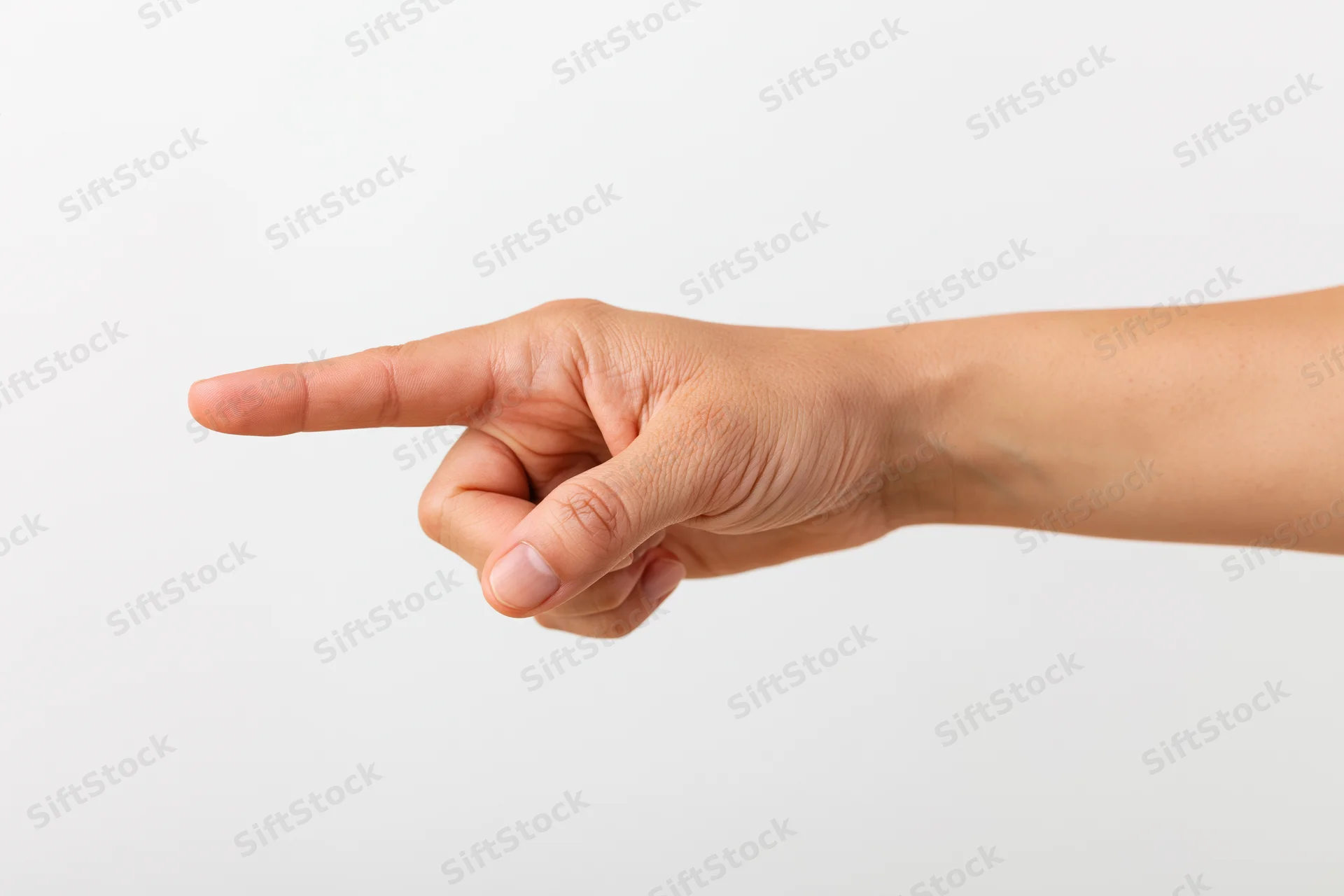 Hand with index finger extended pointing sideways against white background