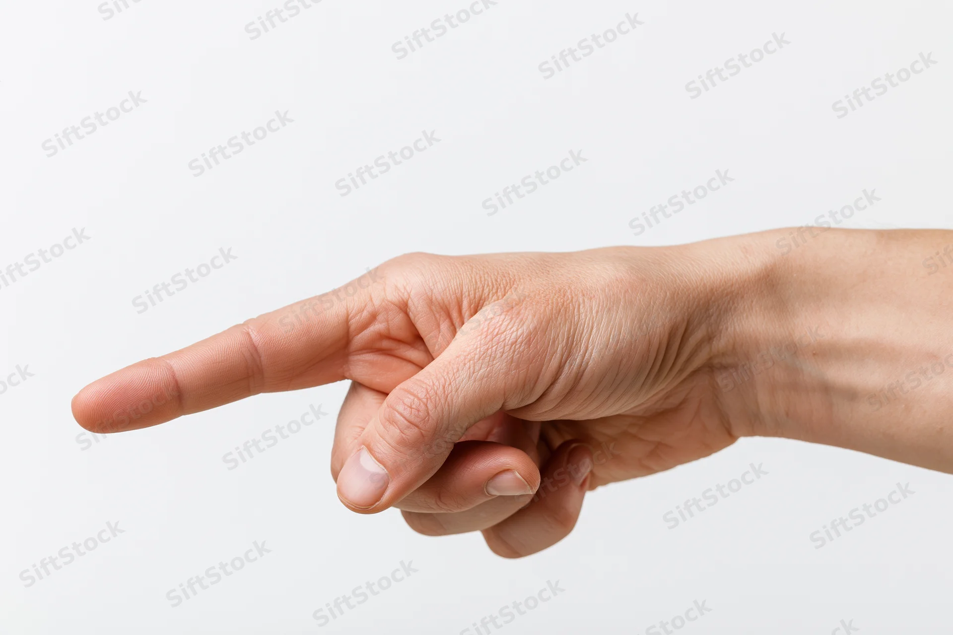 Hand with index finger extended pointing sideways against white background
