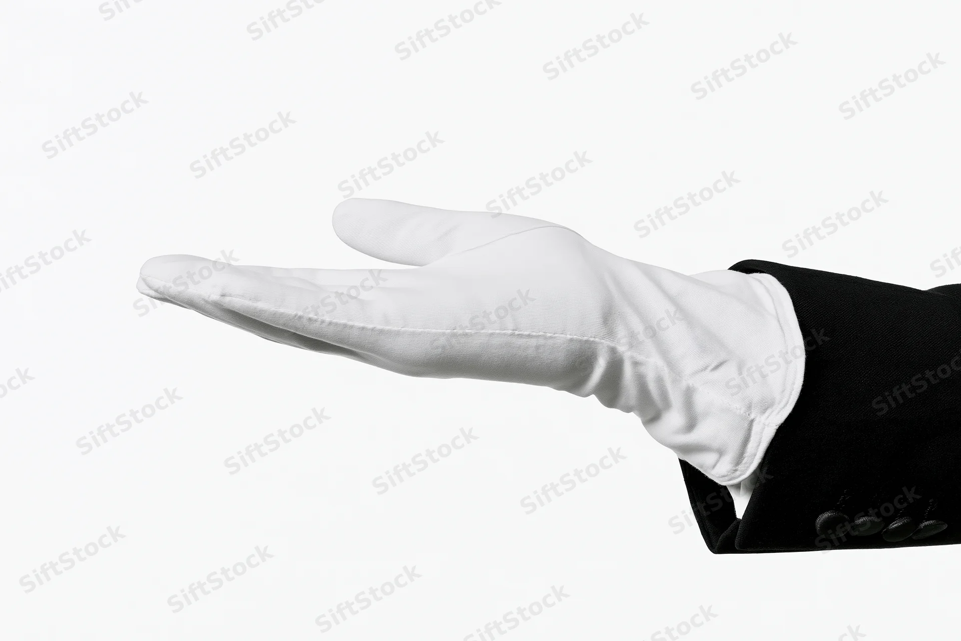 Gloved hand extended palm up in formal suit sleeve against white background
