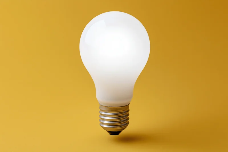 Glowing incandescent light bulb floating centered against a yellow background